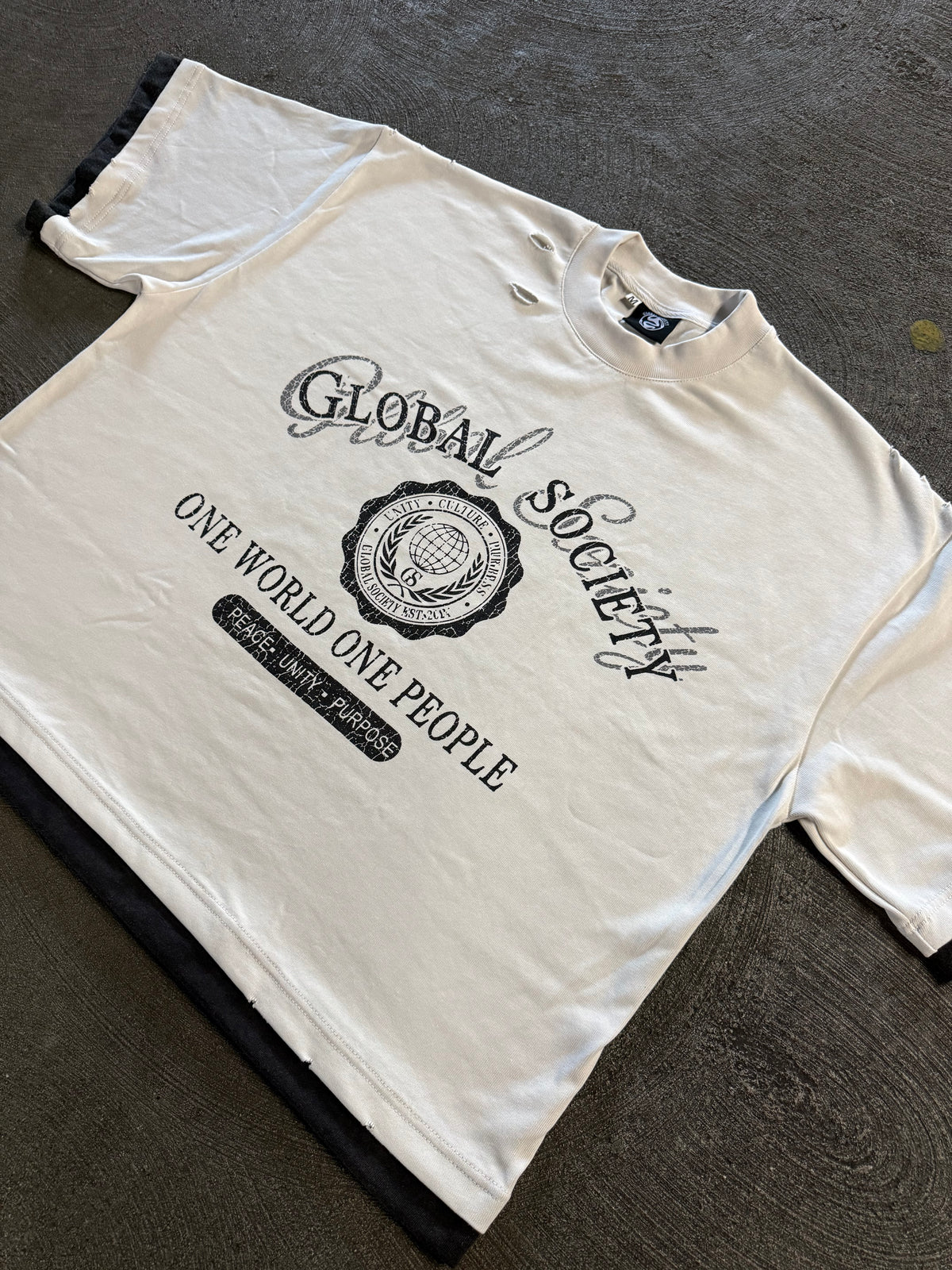 Unisex “One World One Piece” Tee